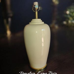postmodern porcelain cream colored lamp with brass base
