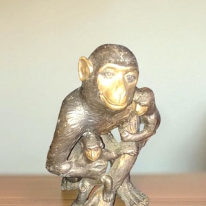 sculpted bronze chimpanzee statue