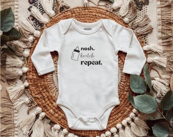 Nosh. Kvetch. Repetir. Body infantil de manga longa