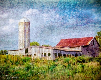 Falling down, a rural barn quietly slides into disrepair on a rural farm