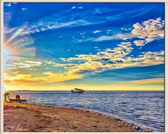 Float plane and kayakers at Sunset Beach, Tarpon Springs Florida