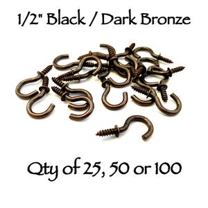 May include: A collection of 1/2" black and dark bronze metal cup hooks with threaded screw ends. The text 1/2" Black / Dark Bronze and Qty of 25, 50 or 100 is visible. These small hardware fasteners feature a curved hook design for hanging items.