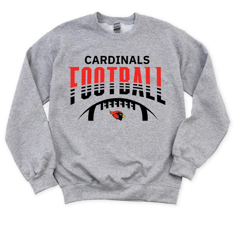 Peut inclure: Sweat-shirt gris avec un graphique noir et rouge d'un ballon de football avec le texte "CARDINALS FOOTBALL" au-dessus.