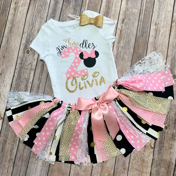 pink black and gold outfit