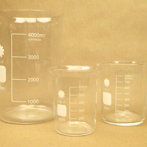 May include: Three clear glass beakers with graduated markings. The largest beaker is 4000 ml, the middle beaker is 600 ml, and the smallest beaker is 800 ml.