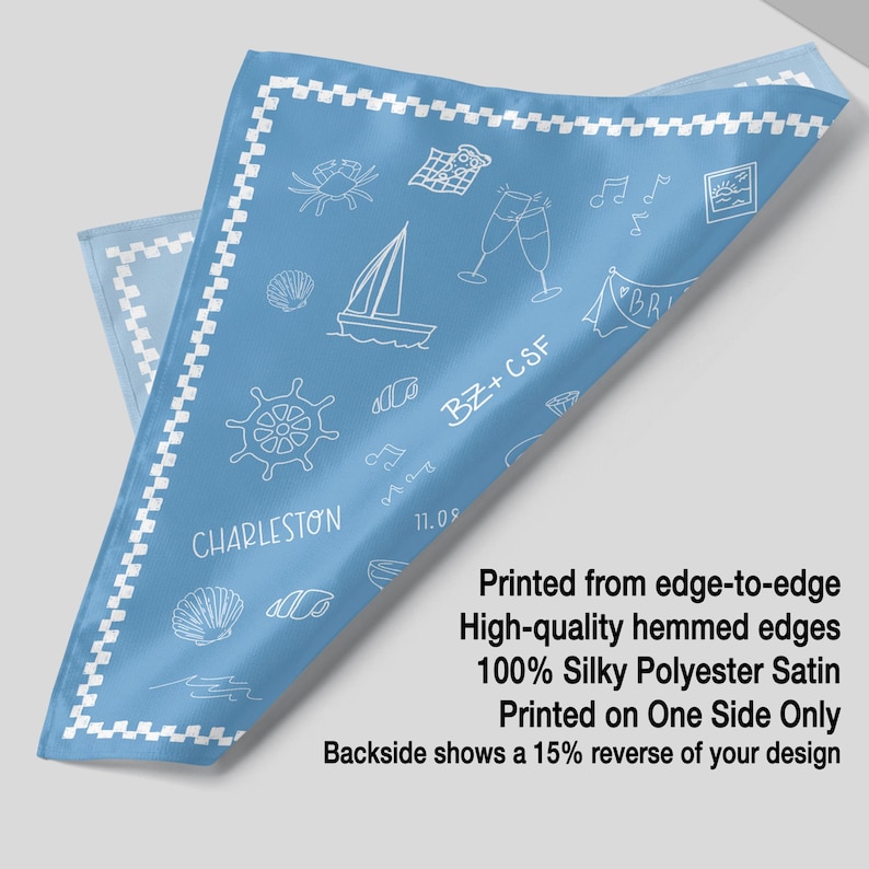 The image is a printed fabric with a design featuring various objects such as a ship, a boat, a lighthouse, and a crab. The text indicates that the fabric is printed from edge-to-edge, has high-quality hemmed edges, and is made of silk polyester satin. The fabric is printed on one side only, and the backside shows a 15% reverse of the design.