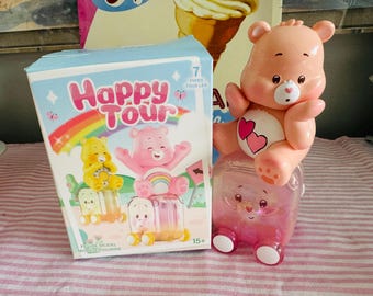 Figurine de poupée Happy Tour Love a Lot Baby Carebear rose avec bagage - boîte incluse