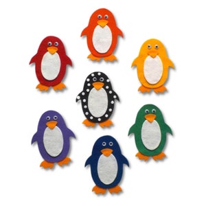May include: Seven felt penguin appliques in different colors: orange, red, yellow, black with white polka dots, purple, green, and blue. Each penguin has a white belly and orange feet.