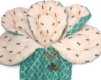 Teal green bunting with pineapples on peach stroller liner