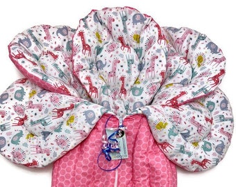 Pink dot outside with nursery zoo animals inside stroller liner