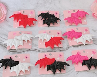 Pinzas para el cabello con alas de murciélago, rojas, negras, rosas, plateadas y blancas