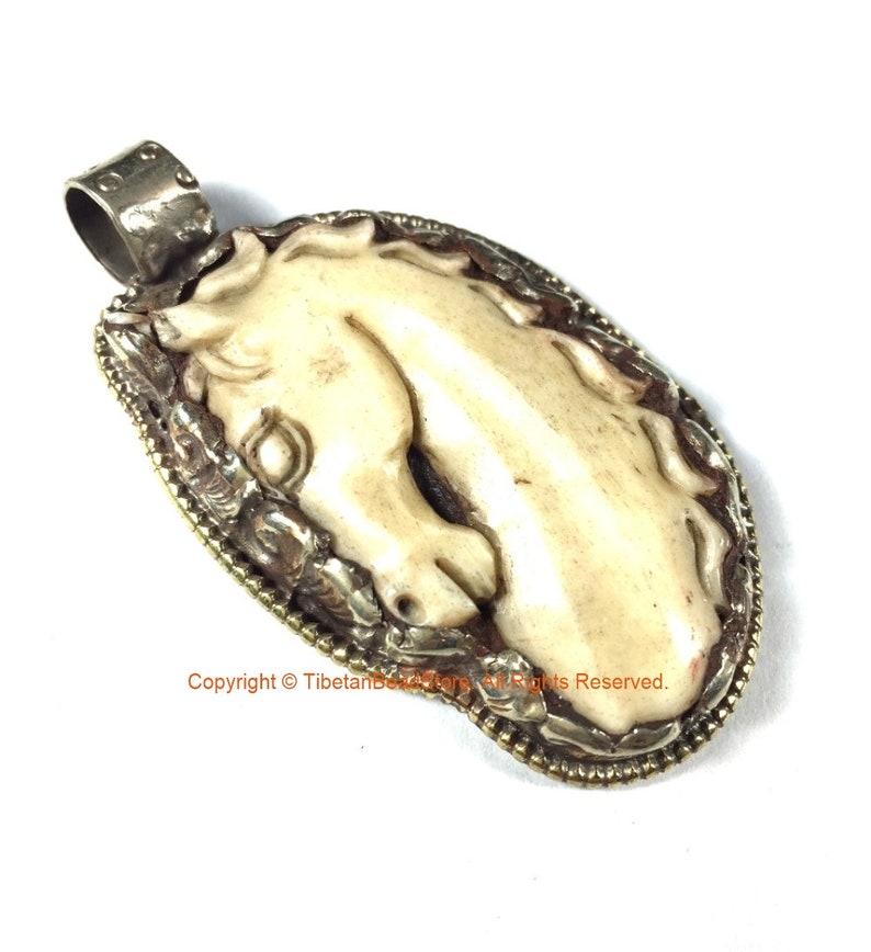 Carved Bone Horse Pendant Ethnic Tibetan Carved Bone Horse Pendant with Tibetan Silver Lotus Detail WM7787A Handmade Tibetan Jewelry