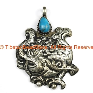 Ethnic Tribal Nepal Antique Look Repousse Tibetan Silver Guardian Deity Pendant with Turquoise Inlay - Nepal Tibet Jewelry - WM7205
