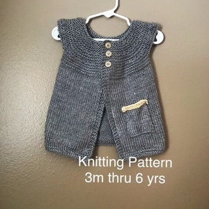 May include: A gray knitted sleeveless vest with a pocket and buttons. Knitting Pattern 3m thru 6 yrs.