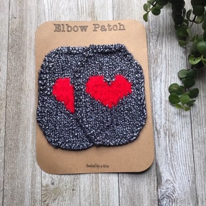 Red Heart ElbowPatches, Valentine’s Day sweater, Black and white speckled elbow patches hand knit with red heart.