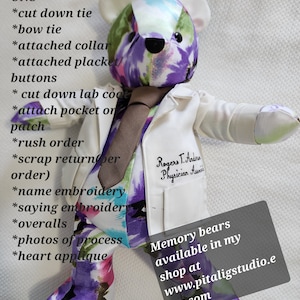 May include: A white memory bear with a purple, blue, and green floral print lab coat. The bear is wearing a brown tie and has a name tag that says "Rogers T. Anderson, Physician Assistant". The text "Memory bears available in my shop at www.pitaligstudio.etsy.com" is on a black rectangle in the bottom right corner of the image.