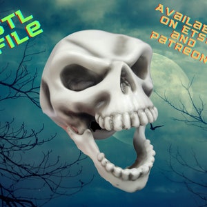 May include: A white 3D printed skull with an open mouth and visible teeth. The skull is against a dark blue background with white clouds and a full moon. The text "STL FILE" is in the upper left corner and "AVAILABLE ON ETSY AND PATREON" is in the upper right corner.