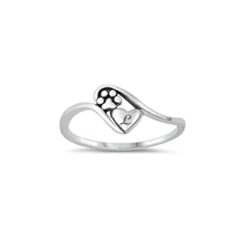 May include: Silver ring with a heart design featuring a paw print and the letter L.