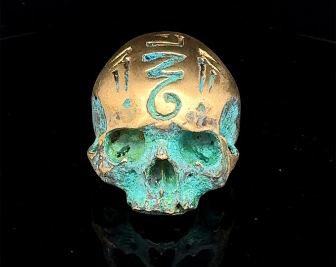 “Amulet skull ring” patina