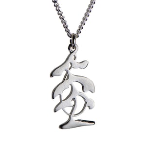 May include: A silver necklace with a pendant featuring a stylised Chinese character.