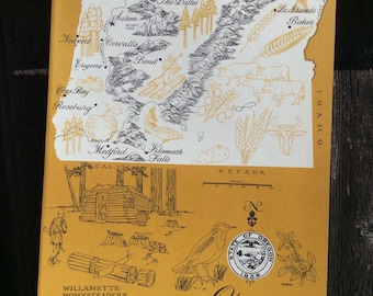May include: A vintage map of Oregon with a yellow background and black and white illustrations. The map shows the state's major cities, rivers, and mountains. The map also includes a seal of the state of Oregon with the text "State of Oregon 1859".