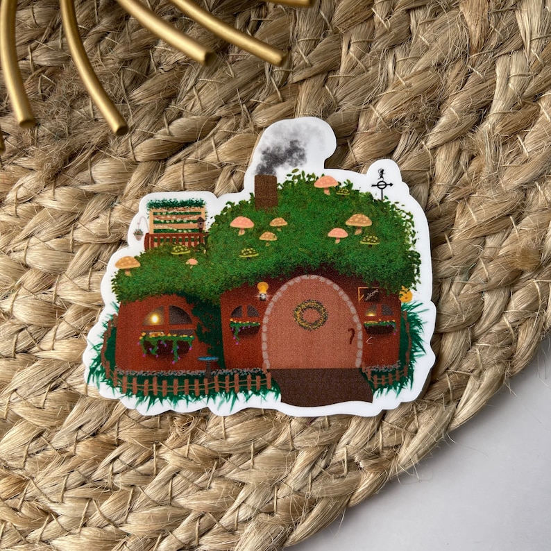 May include: A whimsical illustration of a brown and green mushroom house with a wooden door and a wreath. The house is surrounded by greenery and mushrooms.