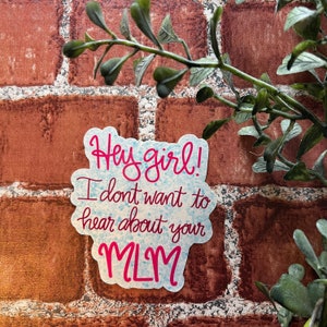 May include: A sticker with a blue background and pink text that says "Hey girl! I don't want to hear about your MLM."