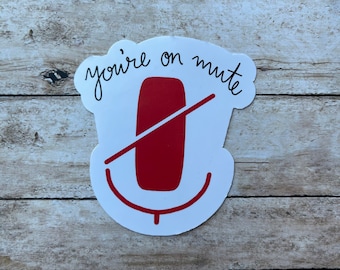May include: White sticker with a red microphone icon and the text "you're on mute" in black cursive.