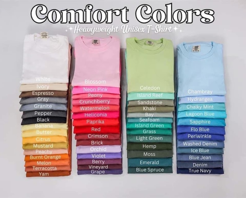 May include: Stacks of folded Comfort Colors heavyweight unisex t-shirts in various colors, including white, pink, green, and blue. Each stack displays a different color with a corresponding color name label. The image features the text "Comfort Colors".