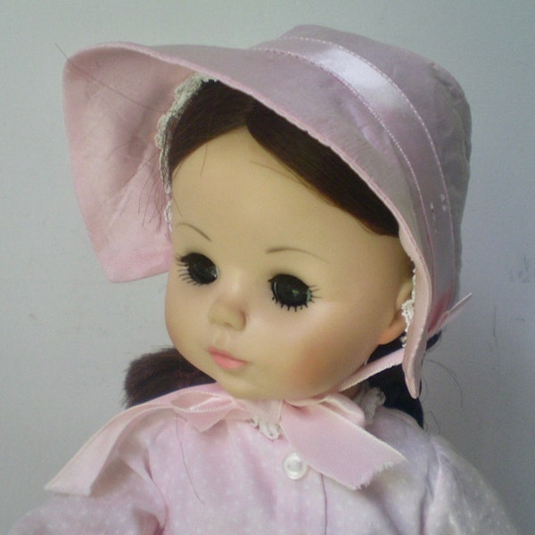 REBECCA doll- Vintage Madame Alexander 14" doll in pink dress n bonnet- long sleeve pink dotted dress- brown braids with bonnet-sleep eyes