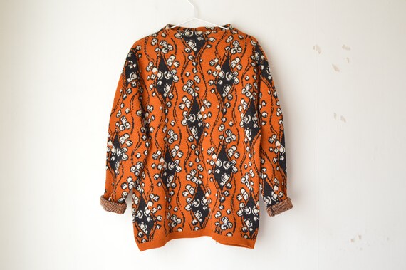 vintage burnt orange and black floral ornament woo