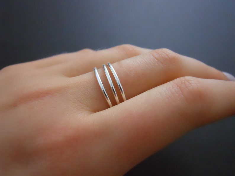 thin silver ring with tiny diamond