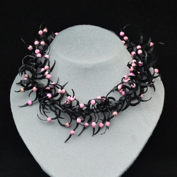 Black necklace with pink worked seed beads