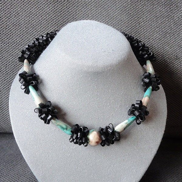 Necklace / Black necklace with green beige glass beads.