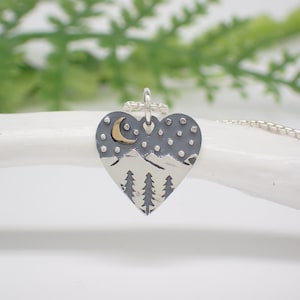Sterling silver heart pendant with pine trees, mountains, crescent moon and stars made from Recycled Silver