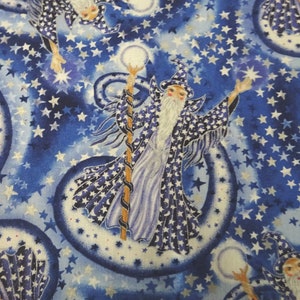 May include: A repeating pattern featuring wizards in blue robes, white beards, and hats, holding staffs, and surrounded by stars. The background is a gradient of blue hues with silver stars and white orbs.
