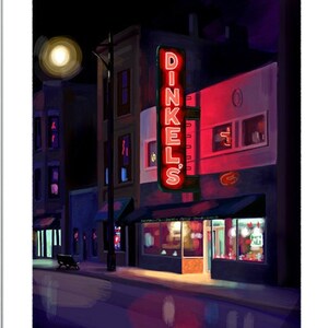 May include: A framed illustration of a city street at night with a red neon sign that reads "DINKEL'S". The building is brick and has a few windows. The street is empty except for a motorcycle parked in the distance.