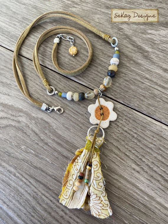 Beaded necklace with fabric best sale tassel
