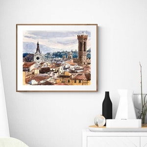 May include: Watercolor painting of a cityscape with a tall tower and a church in the background. The buildings are painted in shades of brown, orange, and yellow. The sky is a light blue with clouds.