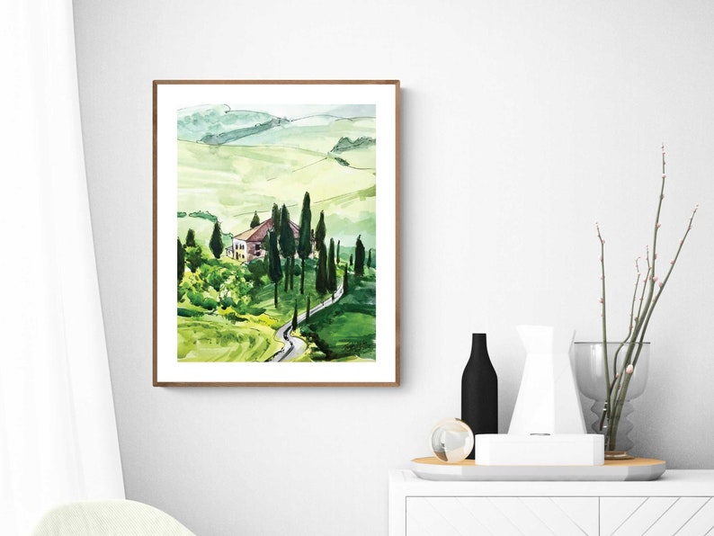May include: A watercolor painting of a house in a green, rolling landscape with a winding road leading up to it. The house is surrounded by trees and the landscape is painted in shades of green and brown.