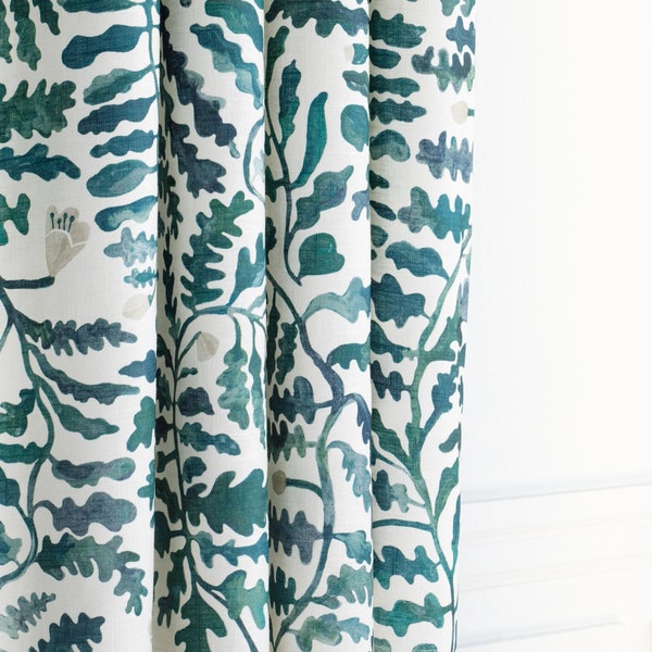 This soft, linen-blend drapery botanical print in a palette of deep teal and forest green with blush floral accents, off white backdrop.