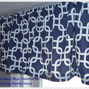 May include: Navy blue valance with a white geometric chain link pattern. The valance is pleated and hangs from a rod. The text "Gotcha Navy Blue Valance By Frosting Home Decor" is visible at the bottom.
