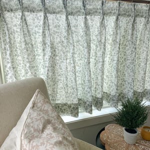 This fresh linen has a lightweight weave with an airy drape gray green floral print.  Pleated cafe curtain summer airy feel