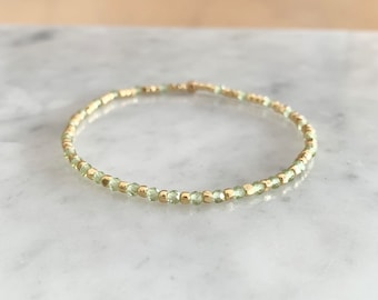 Peridot 2mm bead stretch bracelet with tiny faceted round beads august birthstone bracelet