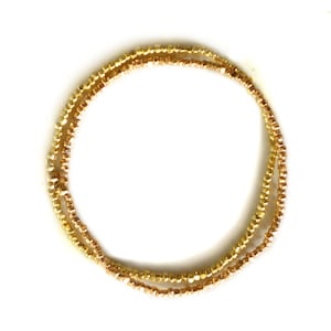 Rosegouden stretch enkelband met gefacetteerde nugget rocaille