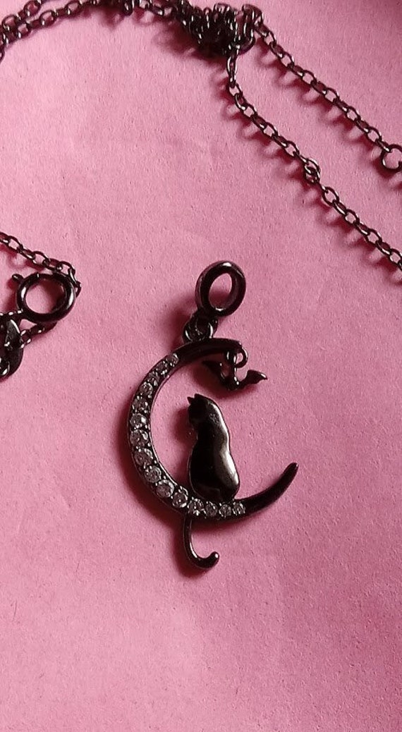 cat with bat on moon Petite black sterling pendant