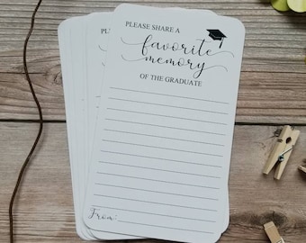 May include: White card with black text that reads "Please share a favorite memory of the graduate."  The card has a black graduation cap icon.  The card has lined space for writing and a space for the person's name at the bottom.