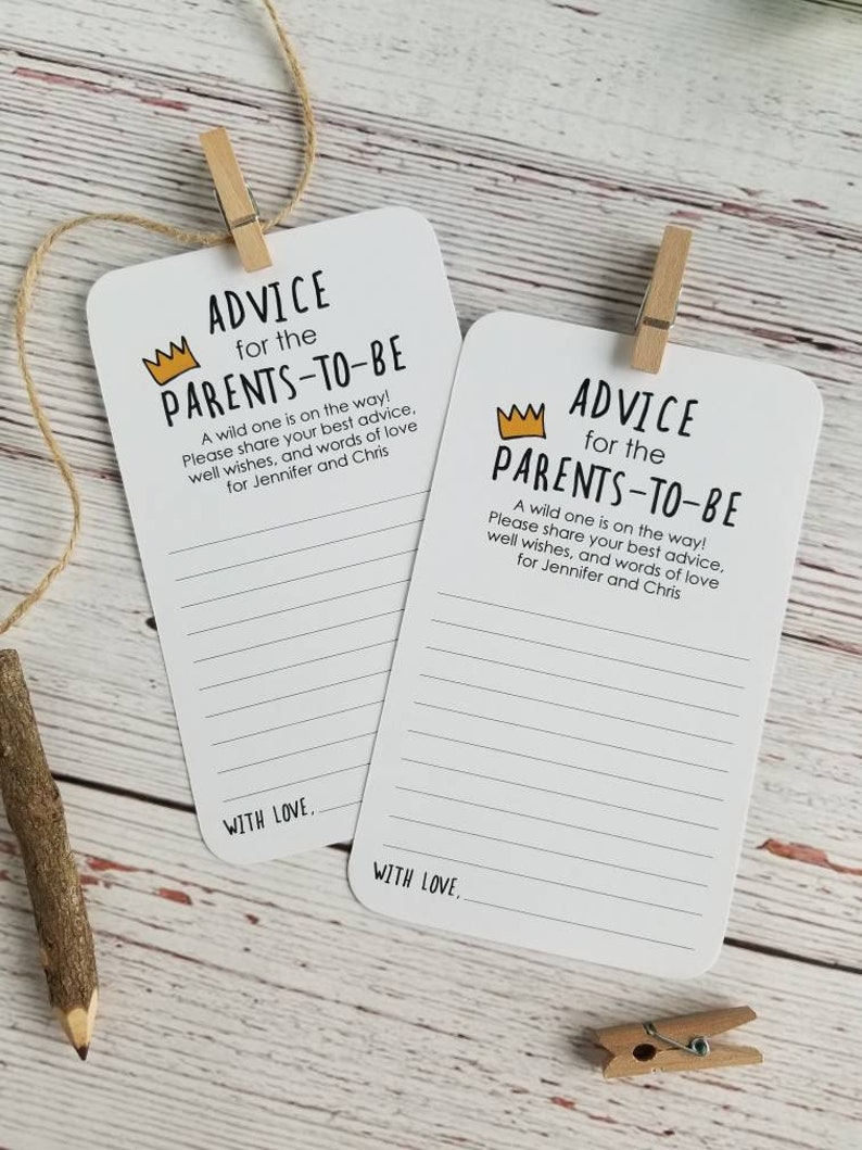 May include: Two white cards with black text and a yellow crown graphic. The text reads "Advice for the Parents-to-be". A wild one is on the way! Please share your best advice, well wishes, and words of love for Jennifer and Chris. With love."