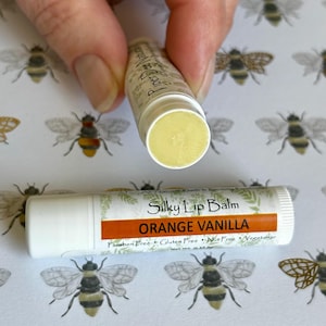 Orange Vanilla all-natural lip balm, Cocoa Butter & Beeswax formula with Jojoba Oil, handmade in small batches.