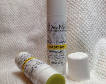 May include: Two white tubes of hand and heel balm with a green label that reads "er Dee Natur Al-Natural Bath & Beauty Hand to Heel Balm FOR DRY SKIN CITRUS SCENT - Paraben Free Gluten Free Nut Free Vegetarian Net Wt. 0.5 oz"